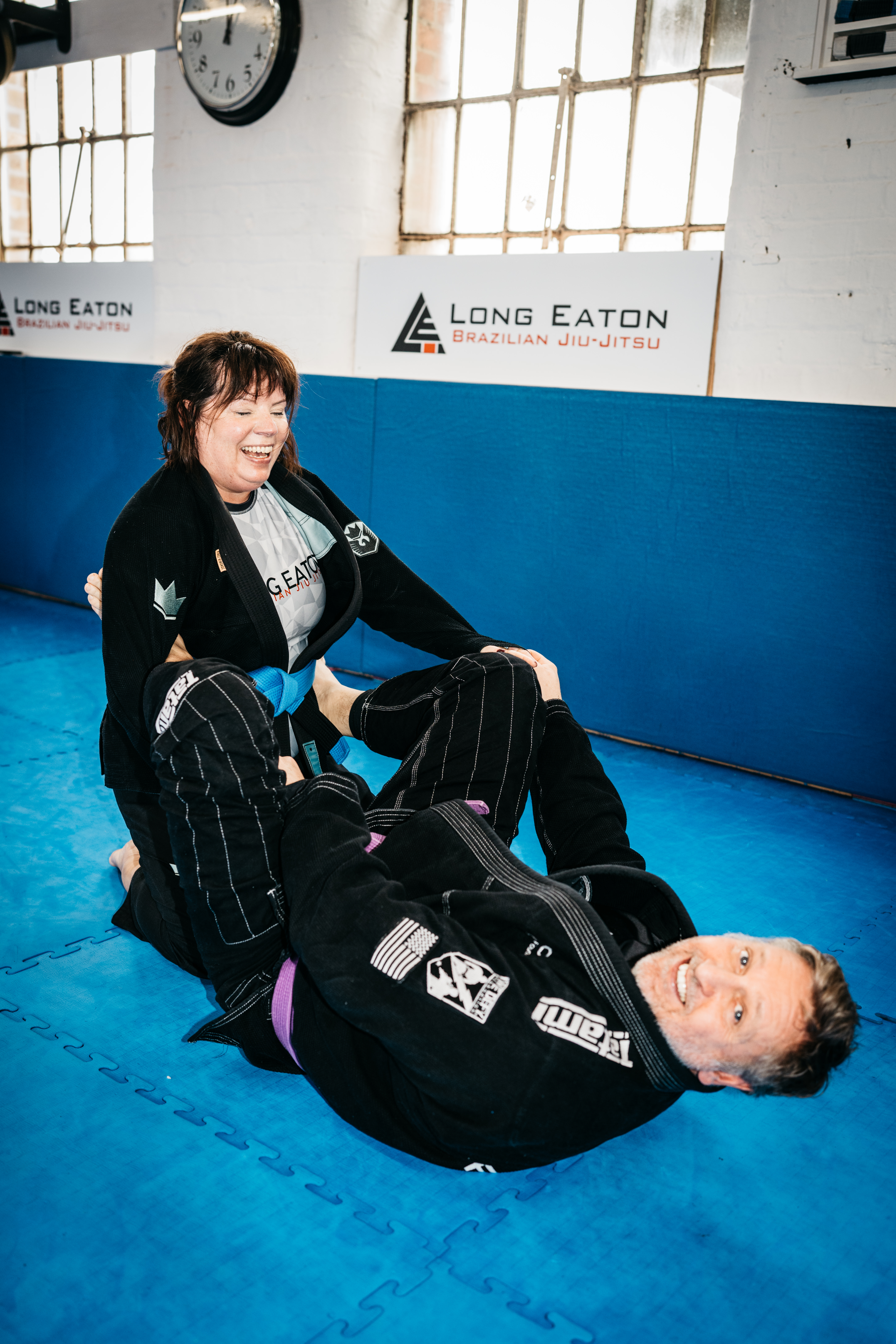 Two students drilling a BJJ technique together during class at Long Eaton BJJ